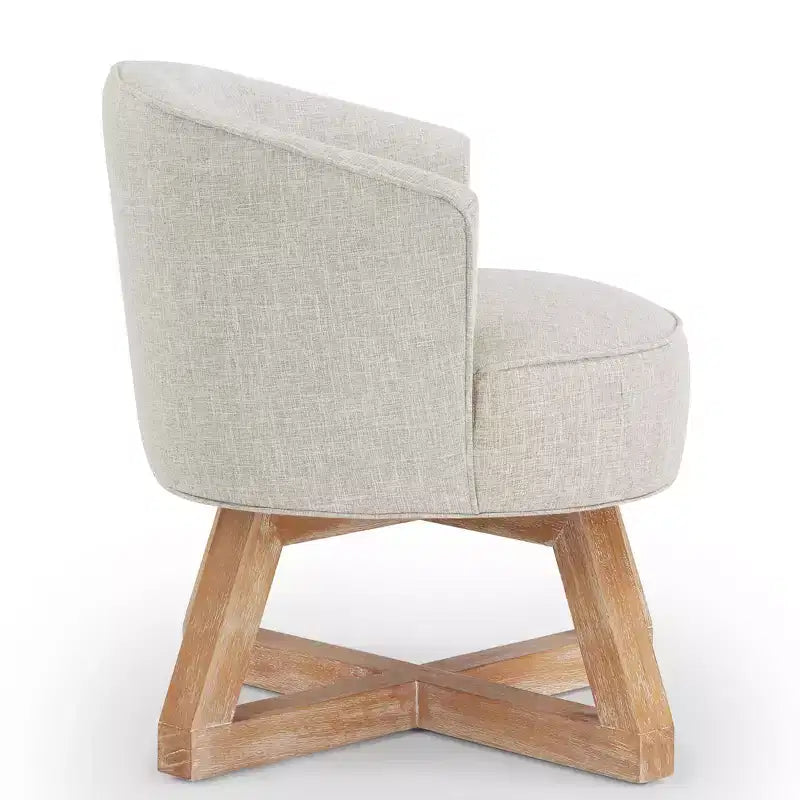 Chaise GDFStudio Glenn pivotante à 360°, avec revêtement en lin et piétement croisé en bois d'hévéa