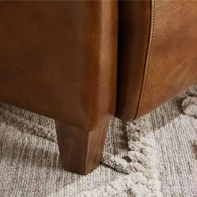 Fauteuil Art Leon en cuir avec design matelassé pour un confort intemporel