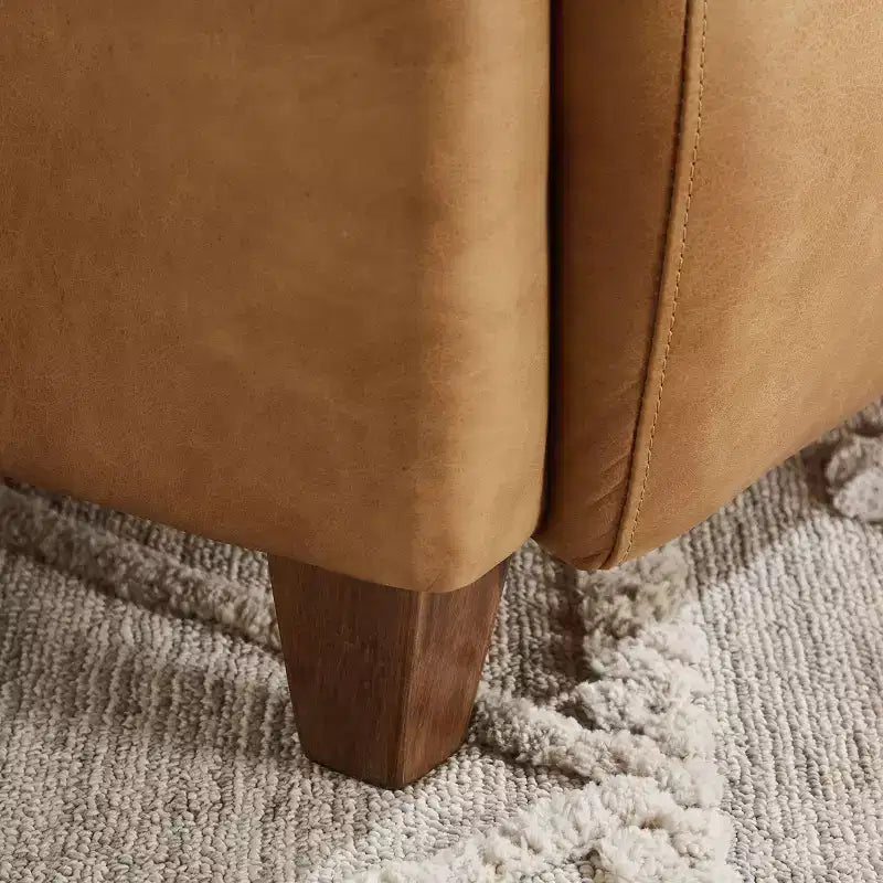Fauteuil Art Leon en cuir avec design matelassé pour un confort intemporel