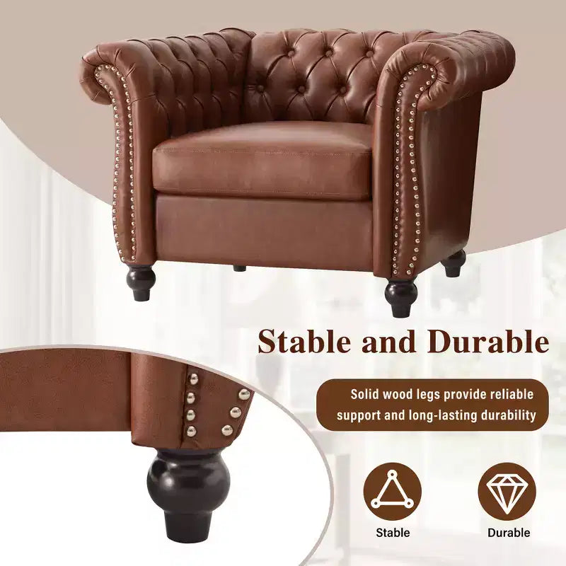Fauteuil club Chesterfield Zeus et Ruta avec accoudoirs volutes, garniture cloutée et pieds en bois massif