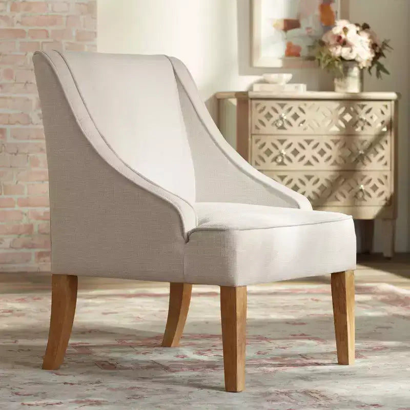 Fauteuil Elm Lane Dixon Ivory en tissu avec accoudoirs incurvés