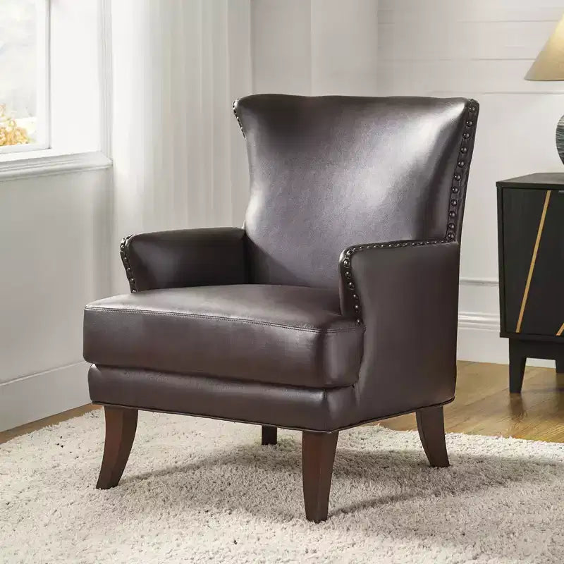 Fauteuil à oreilles en similicuir végane Jorge avec clous décoratifs pour salon et chambre | Karat Home