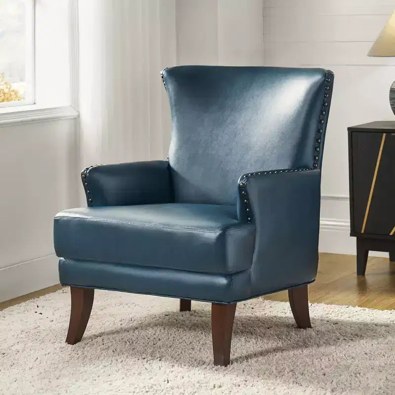 Fauteuil à oreilles en similicuir végane Jorge avec clous décoratifs pour salon et chambre | Karat Home