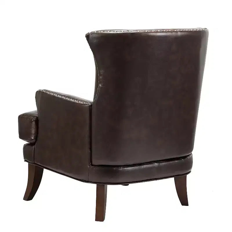 Fauteuil à oreilles en similicuir végane Jorge avec clous décoratifs pour salon et chambre | Karat Home