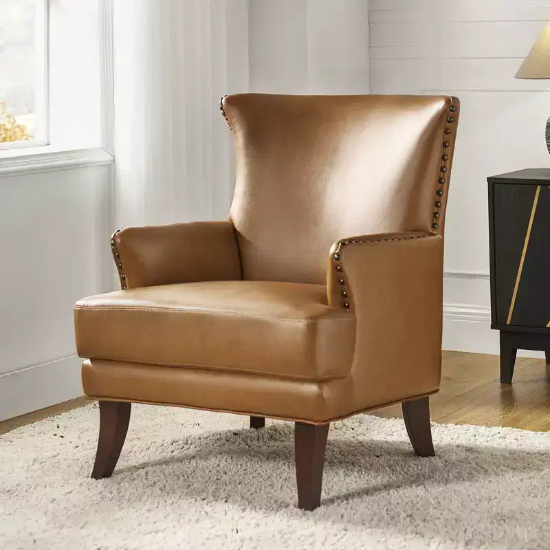 Fauteuil à oreilles en similicuir végane Jorge avec clous décoratifs pour salon et chambre | Karat Home