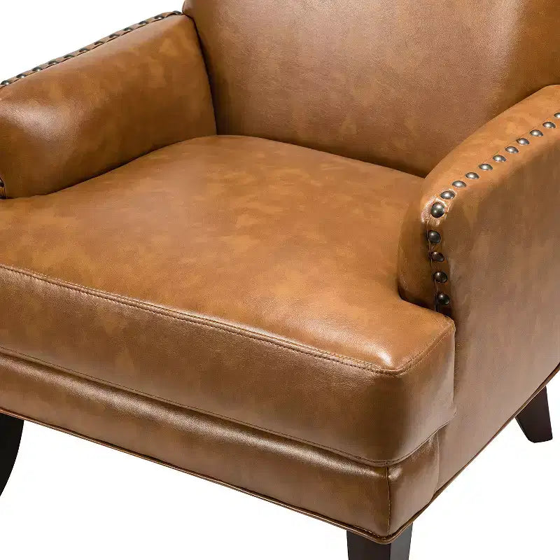 Fauteuil à oreilles en similicuir végane Jorge avec clous décoratifs pour salon et chambre | Karat Home