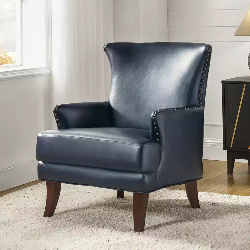 Fauteuil à oreilles en similicuir végane Jorge avec clous décoratifs pour salon et chambre | Karat Home