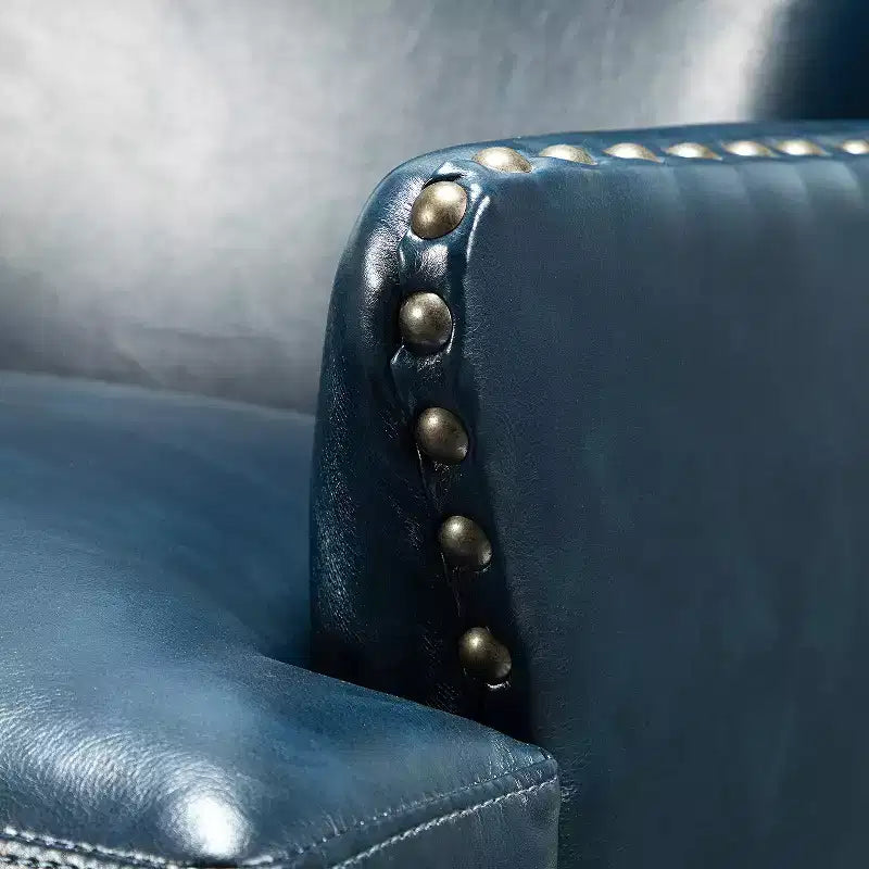 Fauteuil à oreilles en similicuir végane Jorge avec clous décoratifs pour salon et chambre | Karat Home